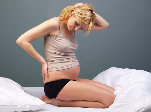 Поздние сроки беременности - один из факторов риска развития геморроя